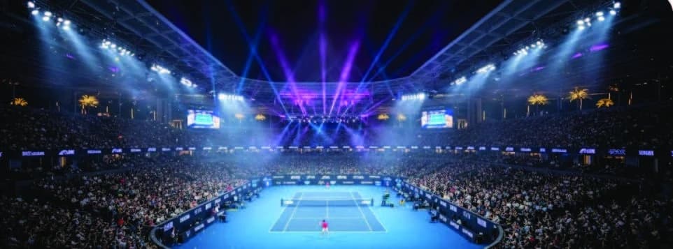 A packed Australian Open arena illuminated above the tennis court
